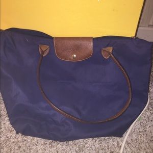 navy blue longchamp long strap medium sized bag